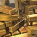 Золото дешевшає після першого за 3 роки підвищення ставки ФРС