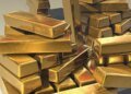 Золото впало до семитижневого мінімуму через загрозу нового підвищення ставок у США