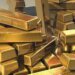 Золото впало до семитижневого мінімуму через загрозу нового підвищення ставок у США